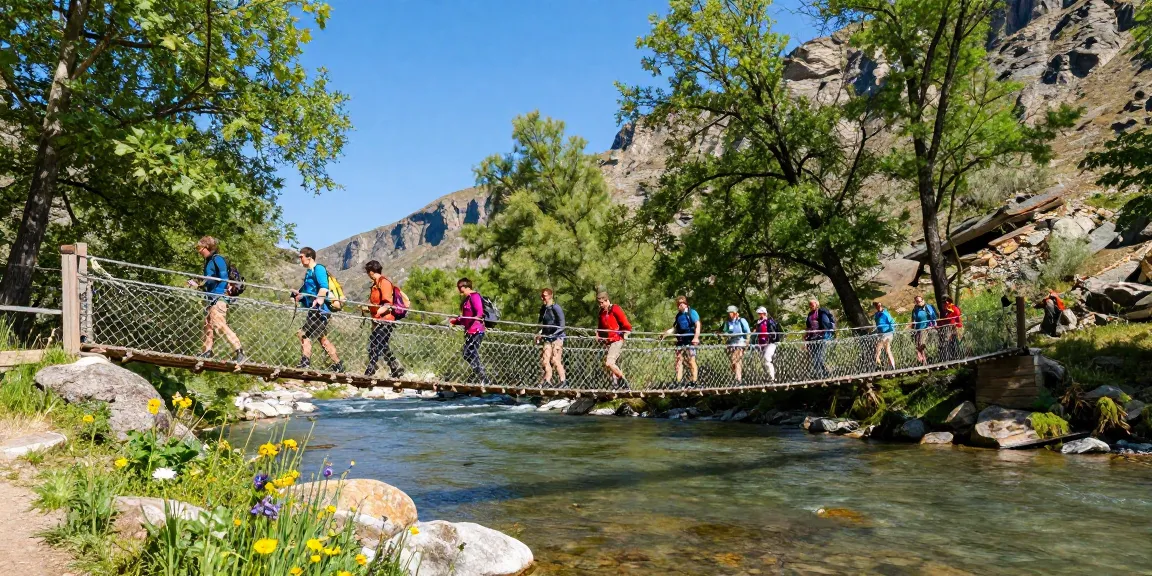 Hikers crossing a River Rope Bridge in a lush green landscape, showcasing outdoor adventure.